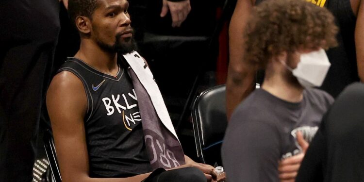 NEW YORK, NEW YORK - FEBRUARY 05: Kevin Durant #7 of the Brooklyn Nets reacts as he sits during a time out against the Toronto Raptors at Barclays Center on February 05, 2021 in New York City. Durant, initially called for a foul, a coach's challenge the on the call was was successful and it was overturned. Durant was not charged with a foul. Durant left the court after contact tracing determined he had contact with someone who tested positive for Covid-19. NOTE TO USER: User expressly acknowledges and agrees that, by downloading and or using this photograph, User is consenting to the terms and conditions of the Getty Images License Agreement.   Elsa/Getty Images/AFP