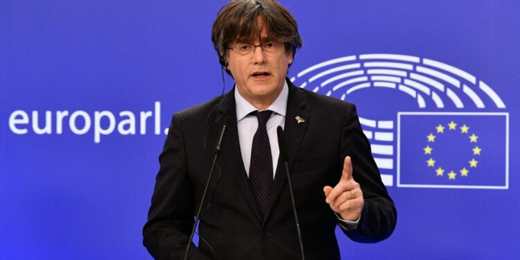Exiled former Catalan leader and member of European Parliament Carles Puigdemont speaks during a press conference at the EU Parliament in Brussels on March 9, 2021, after the European Parliament lifted his  immunity, along with two fellow Catalan MEP's, as they are wanted by Spain for sedition over the organisation of a banned separatist referendum in 2017. (Photo by JOHN THYS / AFP)