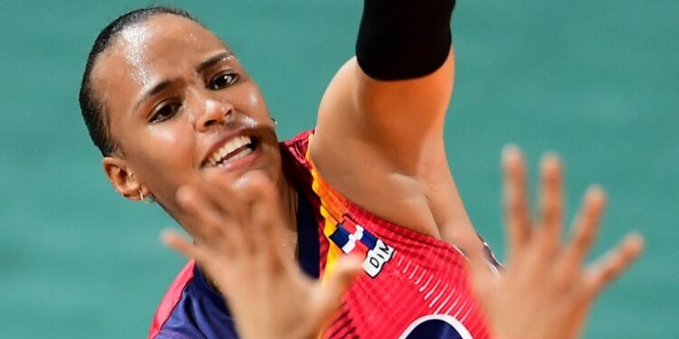 Dominican Republic's Gaila Gonzalez spikes the ball against Colombia during the gold medal match of the women's volleyball competition of the 2018 Central American and Caribbean Games (CAC), in Barranquilla, Colombia, on July 25, 2018. (Photo by Luis ACOSTA / AFP)