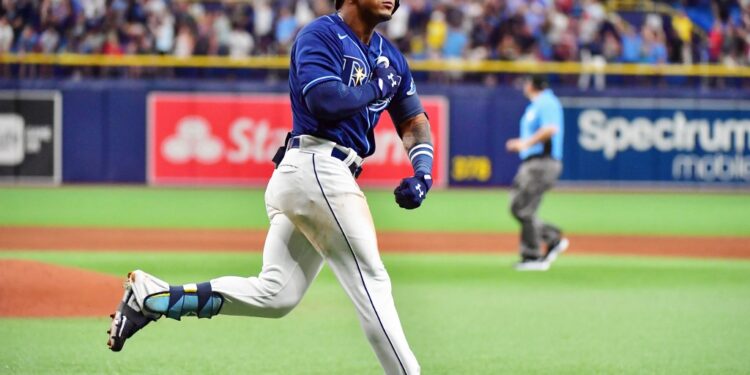 ST PETERSBURG, FLORIDA - JUNE 22: Wander Franco #5 of the Tampa Bay Rays reacts after hitting a two-run home run during his Major League debut in the fifth inning against the Boston Red Sox at Tropicana Field on June 22, 2021 in St Petersburg, Florida. Julio Aguilar/Getty Images/AFP (Photo by Julio Aguilar / GETTY IMAGES NORTH AMERICA / Getty Images