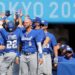 Israel's Mitchell Glasser (3rd L, #22) is congratulated by teammates on his scoring during the seventh inning of the Tokyo 2020 Olympic Games baseball round 1 game between Israel and Mexico at Yokohama Baseball Stadium in Yokohama, Japan, on August 1, 2021. (Photo by KAZUHIRO FUJIHARA / AFP)