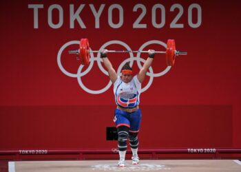 Dominican Republic's Veronica Estela Saladin Tolentino competes in the women's +87kg weightlifting competition during the Tokyo 2020 Olympic Games at the Tokyo International Forum in Tokyo on August 2, 2021. (Photo by Mohd RASFAN / AFP)